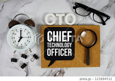 CTO - Chief Technology Officer acronym with alarm clock and magnifying glass, technology concept background 123894512
