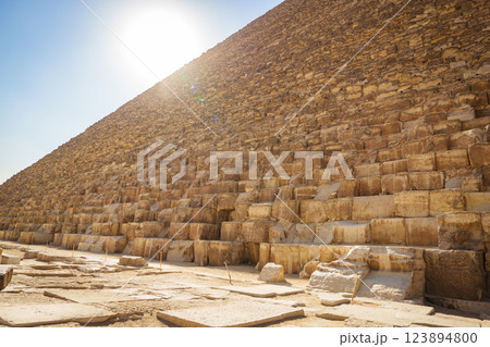 Sunlight illuminates the ancient stones of the Great Pyramid under a clear sky Sunlight illuminates the ancient stones of the Great Pyramid under a clear sky 123894800