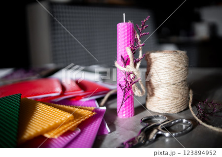 Colorful diy candle making with wax sheets and twine Colorful diy candle making with wax sheets and twine 123894952
