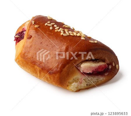 Delicious pastry filled with fruit and topped with sesame seeds Delicious pastry filled with fruit and topped with sesame seeds 123895633