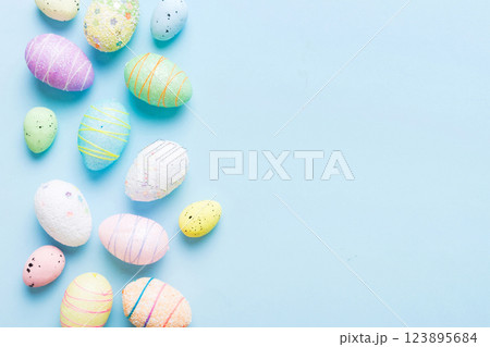 decorative easter eggs on colored background. easter eggs collection top view with copy space decorative easter eggs on colored background. easter eggs collection top view with copy space 123895684