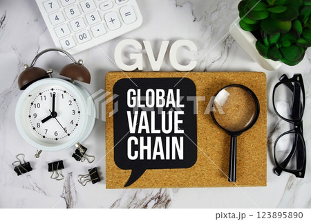 GVC - Global Value Chain acronym with calculator, alarm clock and magnifying glass, Business and Financial concept background GVC - Global Value Chain acronym with calculator, alarm clock and magnifying glass, Business and Financial concept background 123895890