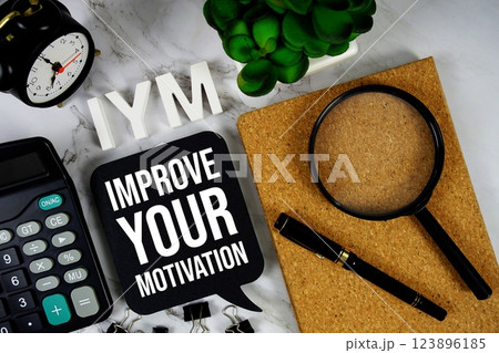 IYM - Improve Your Motivation acronym with calculator, alarm clock and magnifying glass, business concept background IYM - Improve Your Motivation acronym with calculator, alarm clock and magnifying glass, business concept background 123896185