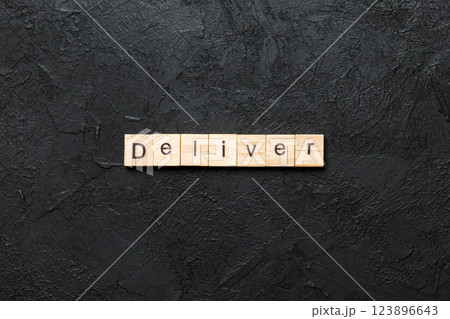 deliver word written on wood block. deliver text on table, concept deliver word written on wood block. deliver text on table, concept 123896643
