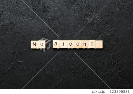 No alcohol word written on wood block. No alcohol text on cement table for your desing, Top view concept 123896881