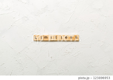 Limitless word written on wood block. Limitless text on cement table for your desing, concept Limitless word written on wood block. Limitless text on cement table for your desing, concept 123896953