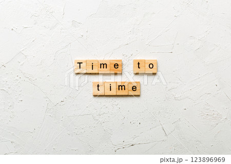 Time to time written on wood block. Time for planning text on table, concept Time to time written on wood block. Time for planning text on table, concept 123896969