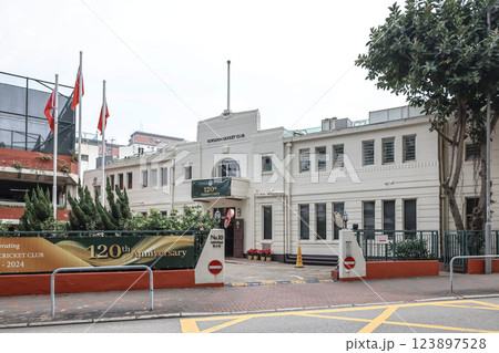 Dec 24 2024 Kowloon Cricket Club Entrance with School Sign and Urban Background at HK 123897528