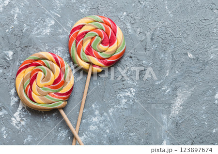 Set of colorful lollipops on colored background. Summer concept. Party Happy Birthday or Minimalist Concept Set of colorful lollipops on colored background. Summer concept. Party Happy Birthday or Minimalist Concept 123897674