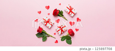 Kraft Gift box with beautiful red ribbon and rose, concept of Valentine day, anniversary, mother day and birthday greeting, copy space, top view 123897708