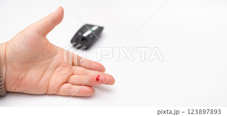 Woman checking blood sugar close up 123897893