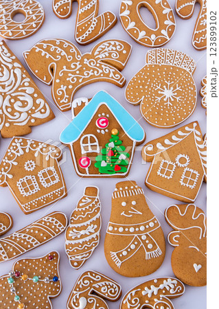 Gingerbread decorated with white sugar glaze. Food background. Christmas cookies. Gingerbread decorated with white sugar glaze. Food background. Christmas cookies. 123899102