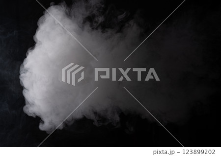 Cloud of white smoke on a black background closeup Cloud of white smoke on a black background closeup 123899202