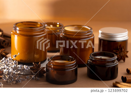 A set of different aroma candles in glass jars on a white background. Scented handmade candle. Soy candles are burning in a jar.Wax and paraffin in a jar 123899702