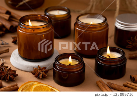 A set of different aroma candles in glass jars on a white background. Scented handmade candle. Soy candles are burning in a jar.Wax and paraffin in a jar 123899716