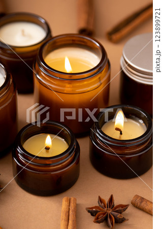 A set of different aroma candles in glass jars on a white background. Scented handmade candle. Soy candles are burning in a jar.Wax and paraffin in a jar 123899721