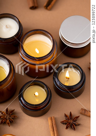A set of different aroma candles in glass jars on a white background. Scented handmade candle. Soy candles are burning in a jar.Wax and paraffin in a jar 123899722