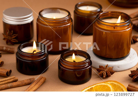 A set of different aroma candles in glass jars on a white background. Scented handmade candle. Soy candles are burning in a jar.Wax and paraffin in a jar 123899727