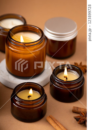 A set of different aroma candles in glass jars on a white background. Scented handmade candle. Soy candles are burning in a jar.Wax and paraffin in a jar 123899728