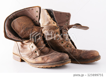 Old shoes on a white background. Leather brown shoe. Worn shoes. Old shoes on a white background. Leather brown shoe. Worn shoes. 123899731