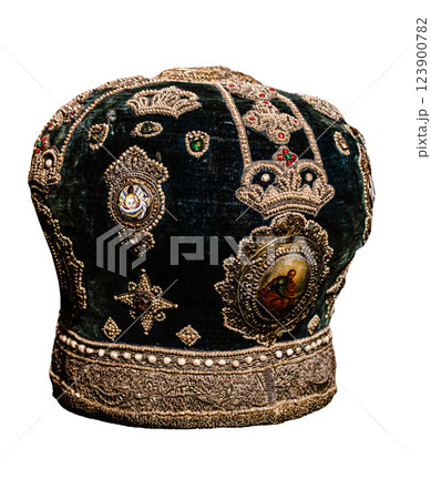 Old hat of the priest of the Orthodox Church. Antique headdress isolated on white background. Miter. Old hat of the priest of the Orthodox Church. Antique headdress isolated on white background. Miter. 123900782