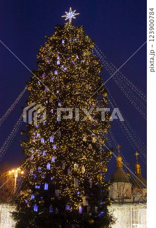 Street city Christmas tree at night. The garlands are burning. Holiday decorations and toys. Garland of lights. Street city Christmas tree at night. The garlands are burning. Holiday decorations and toys. Garland of lights. 123900784