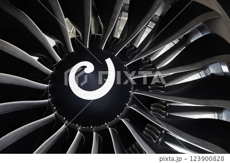 Turbine blades of an aircraft jet engine. Close up Plane Aviation Technologies. Aircraft jet black detail during maintenance background Turbine blades of an aircraft jet engine. Close up Plane Aviation Technologies. Aircraft jet black detail during maintenance background 123900828