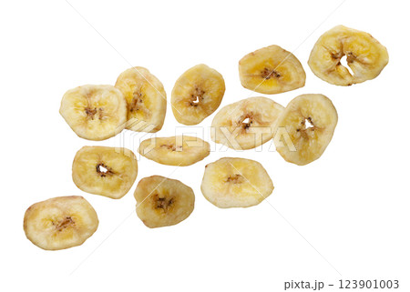 Dried banana chips flying close-up on a white. Isolated Dried banana chips flying close-up on a white. Isolated 123901003
