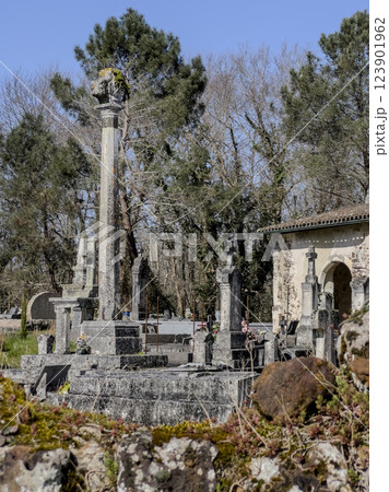 View of La Croix du Cimetiere at Eglise Saint Pierre in Mons, Gironde, France during a serene 123901962