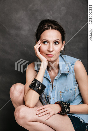 Arrest and jail. Criminal woman prisoner girl in handcuffs Arrest and jail. Criminal woman prisoner girl in handcuffs 123902331