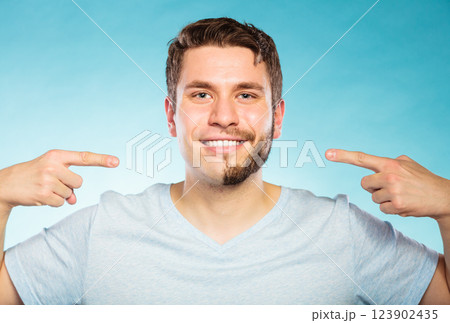 Handsome man with half shaved face Handsome man with half shaved face 123902435