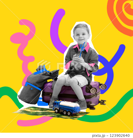 Smiling boy sitting on suitcase with lemonade, with travel gear and toy truck beside him, ready for adventure. Smiling boy sitting on suitcase with lemonade, with travel gear and toy truck beside him, ready for adventure. 123902640