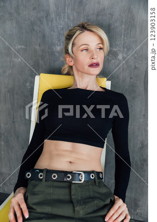 Beautiful fashion blonde woman in military clothes Beautiful fashion blonde woman in military clothes 123903158