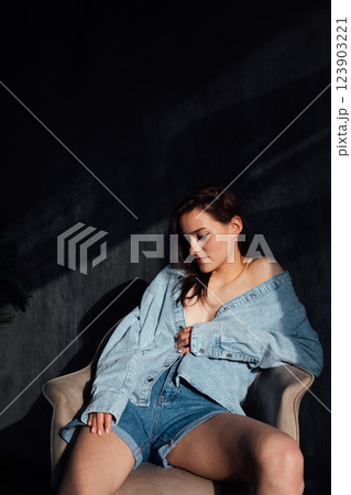 Beautiful Slim Brunette Woman in Denim Jacket Portrait 123903221