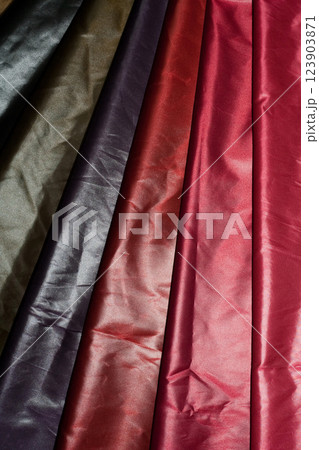 Multi-colored fabrics with a smooth texture and rich shades. 123903871