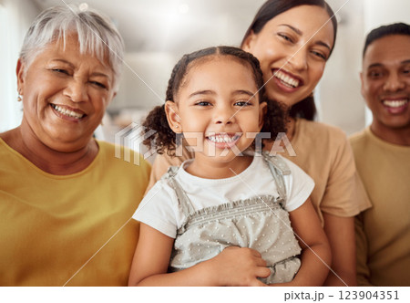 Big family, girl child and mom in house hug by senior grandmother with love in home living room smiling with happiness. Portrait of young kid, happy smile and peaceful mother with dad relax together 123904351