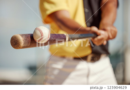 Baseball, bat and ball being hit on a field at a sports training, practice or competition game. Softball, sport equipment and man athlete practicing to swing a wood baton on outdoor pitch or stadium. Baseball, bat and ball being hit on a field at a sports training, practice or competition game. Softball, sport equipment and man athlete practicing to swing a wood baton on outdoor pitch or stadium. 123904629