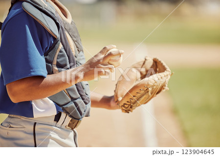 Baseball pitcher, sports and man athlete with ball and glove ready to throw at game or training. Fitness, exercise and professional male softball player practicing to pitch for match on outdoor field 123904645