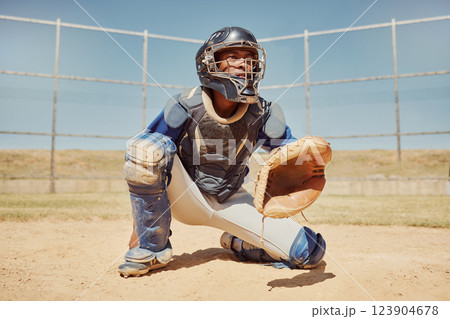 Baseball, sports and man waiting on a field during a game, competition or training. Athlete catcher playing a sport with focus for exercise and fitness in nature or a park at an event in summer 123904678