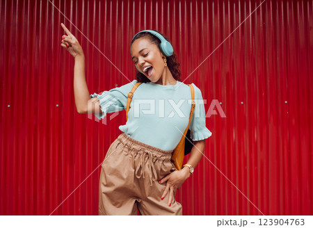 Music, dance and woman in the city against a red background during a travel holiday in Amsterdam in summer. Happy, smile and girl with freedom, 5g radio and singing with headphones on vacation Music, dance and woman in the city against a red background during a travel holiday in Amsterdam in summer. Happy, smile and girl with freedom, 5g radio and singing with headphones on vacation 123904763