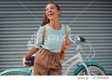 Bicycle, travel and black woman student excited for outdoor lifestyle, eco friendly cycling transport on garage door background. Gen z girl with bike and backpack on her way to college or university 123904800