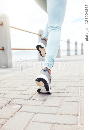 Zoom of runner, sport woman for fitness legs running, training or exercise workout by the sea, beach or ocean. Wellness, health or runner girl with freedom, cardio or energy for marathon or race. 123904847