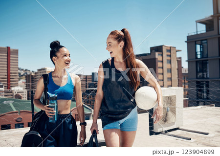 Women go to sports training with ball, rooftop city sports in Colombia or walking to football game. Friends exercise together, happy to exercise in urban lifestyle or healthy soccer coach workout 123904899