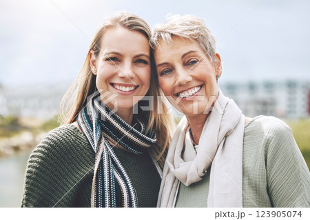 Happy, mother and daughter with smile in nature together in the city of Australia. Face portrait of a young woman with a senior person in the city or park together with love and to relax in happiness 123905074