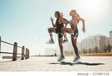 City fitness, woman or man jumping in cardio exercise, workout or training for hearth health, speed or coordination. Sports people, runner friends or couple and energy in high knees wellness warm up 123905126