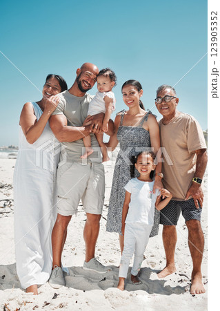 Big family, portrait and smile on beach holiday, vacation or Mexico summer trip. Generations, parents and children on sandy, sea or ocean shore having fun, bonding and spending quality time together. 123905352