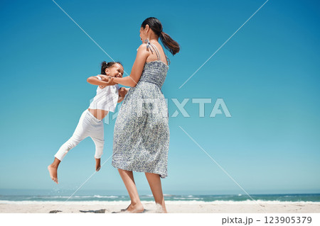 Mother, swing and girl at beach in summer for play, comedy and bonding on vacation, holiday or trip. Mom, child and ocean with smile, happiness and love by sea in sunshine, together and playful time Mother, swing and girl at beach in summer for play, comedy and bonding on vacation, holiday or trip. Mom, child and ocean with smile, happiness and love by sea in sunshine, together and playful time 123905379