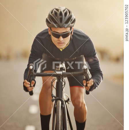 Bike, portrait and man cycling on road, exercise or workout on street outdoor. Health, fitness and male cyclist from Canada riding bicycle on asphalt, pavement or highway training for competition. 123905702