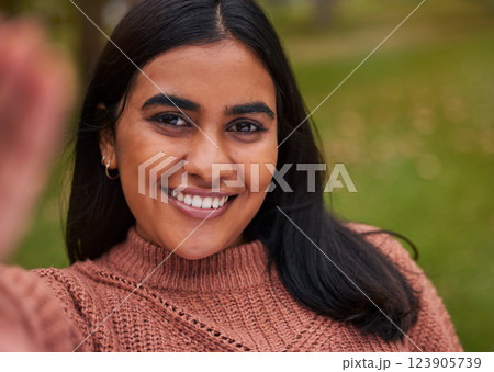 Selfie, smile and happy woman in nature park to relax, happy and have fun outdoor in nature for peace, quiet and freedom. Happiness, grass and calm girl taking picture to post to online social media Selfie, smile and happy woman in nature park to relax, happy and have fun outdoor in nature for peace, quiet and freedom. Happiness, grass and calm girl taking picture to post to online social media 123905739