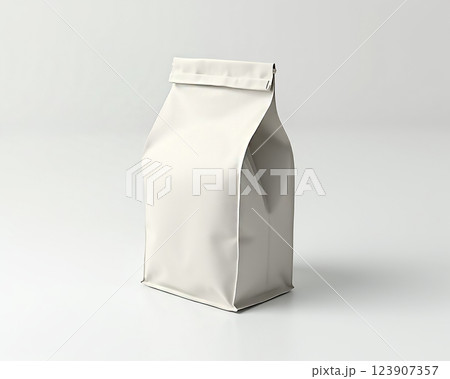 White packaging bag displayed on a minimalist table against a light background in a modern setting 123907357